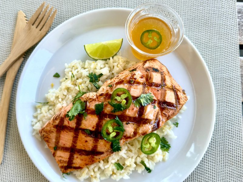 Honey Jalepeno Salmon topped with sweet and spicy honey glaze and fresh jalapeno slices.