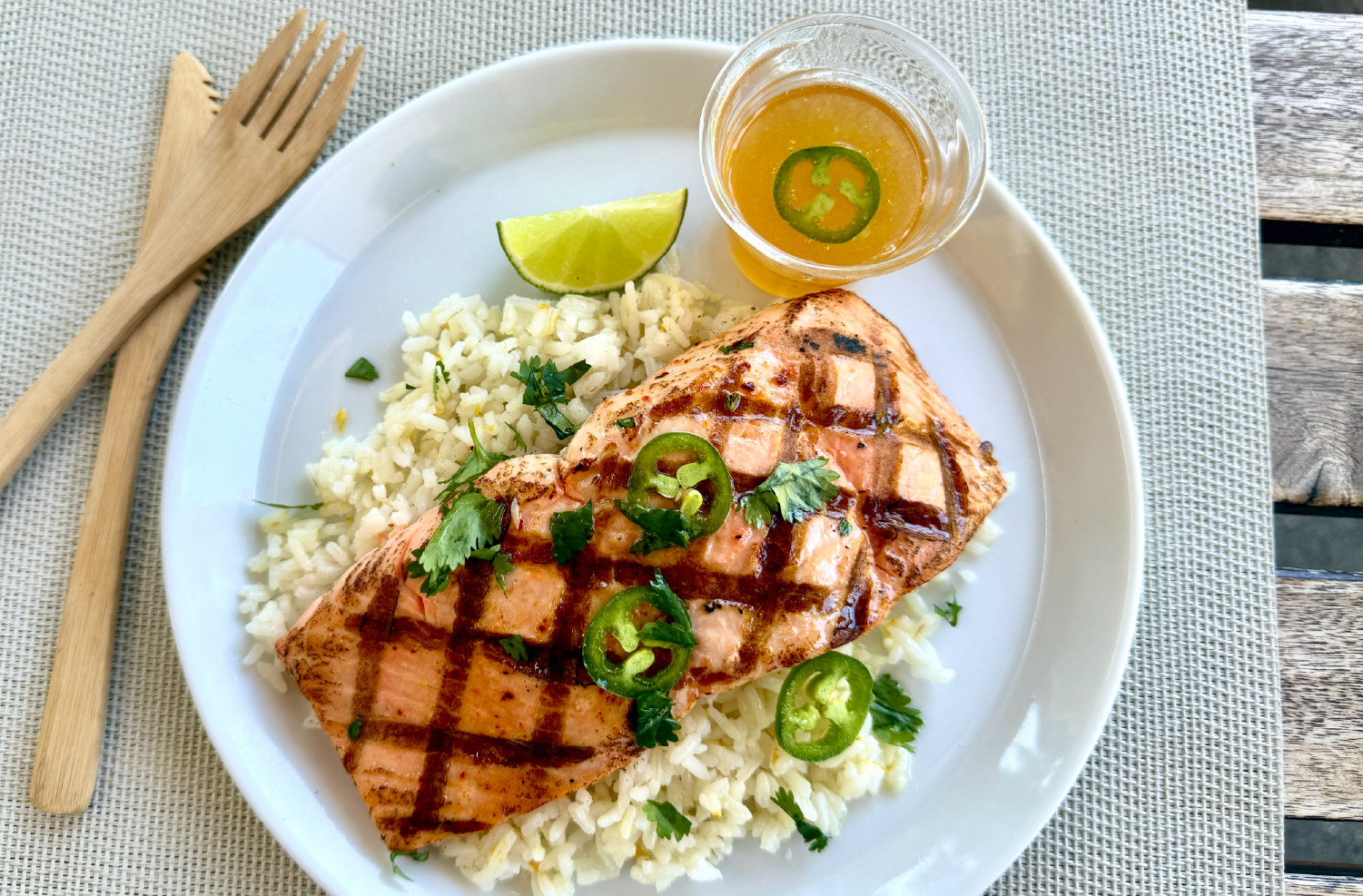 Honey Jalepeno Salmon topped with sweet and spicy honey glaze and fresh jalapeno slices.