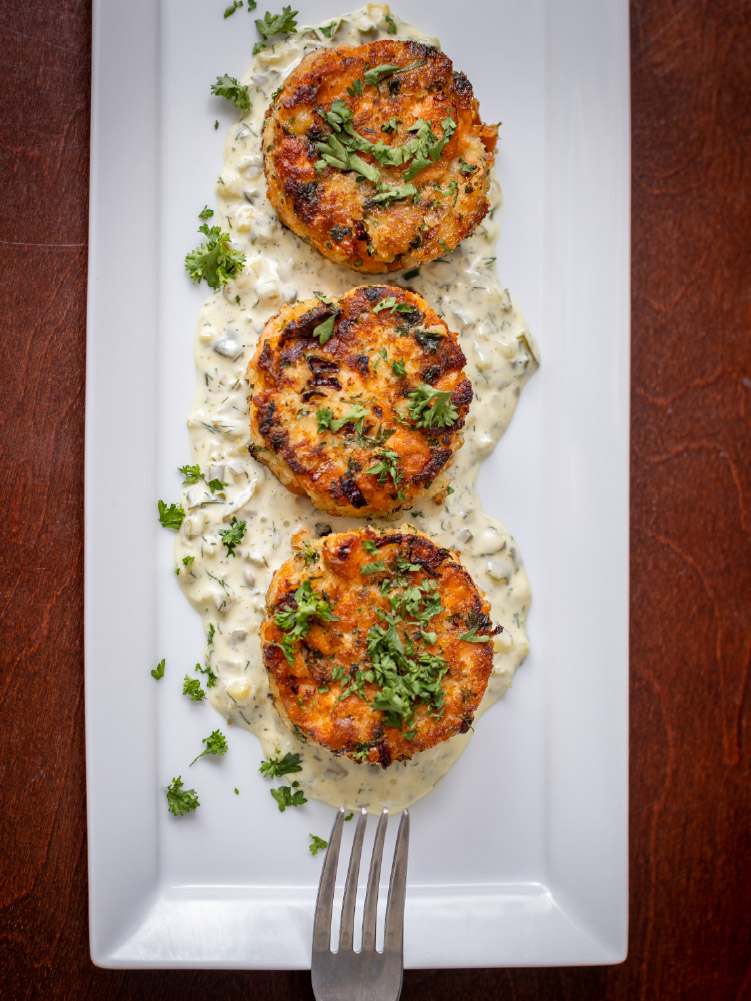 California King Salmon Cakes on a plate with tartar sauce